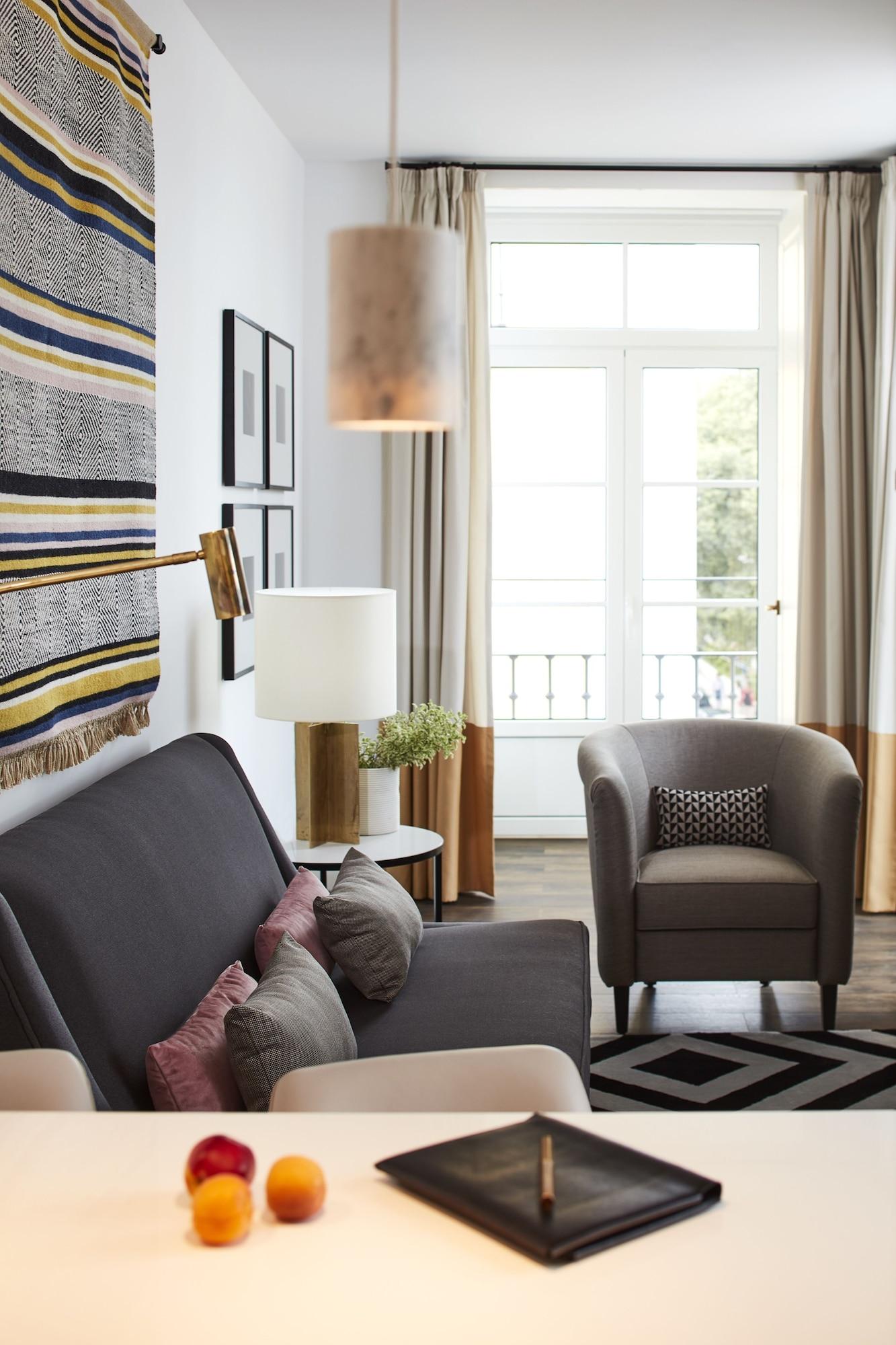 The Lumiares Hotel & Spa - Small Luxury Hotels Of The World Lisboa Εξωτερικό φωτογραφία A living room with a sofa, armchair, and floor lamp